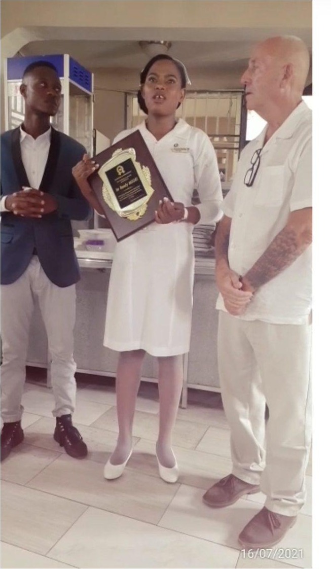 Darline, now a registered nurse in Haiti, with Randy Moore at her recognition ceremony, Cap-Haïtien, 2021