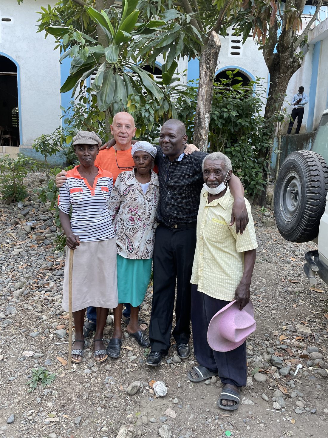 Randy Moore with longtime friends and community members outside a church in Cap-Haïtien